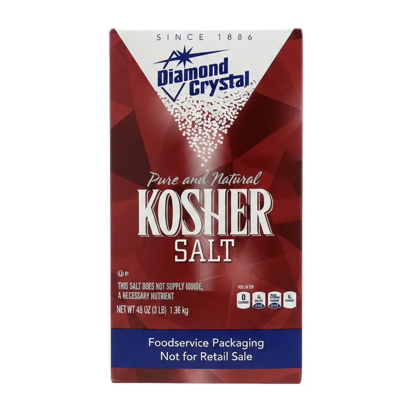 A package of Diamond Crystal Pure and Natural Kosher Salt in a red and white box with a transparent window showing the white salt inside.
