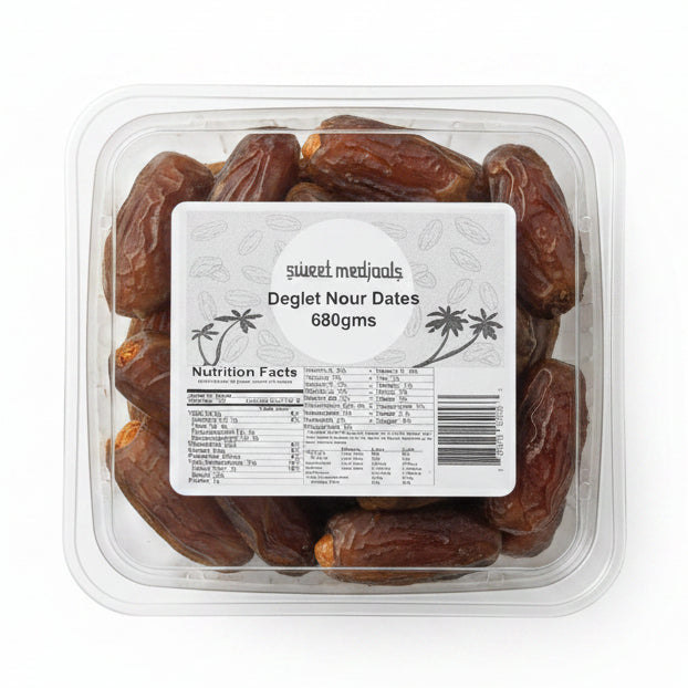 Packaged dried fruits with a label on a metal surface