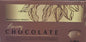 Box of luxury chocolate with cacao bean illustration and text on a brown background