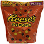 A bag of Reese's Pieces candies against a white background.