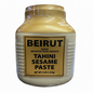A plastic jar of Beirut brand Tahini Sesame Paste, 4 lbs in weight, with a predominantly white label and a gold accent.