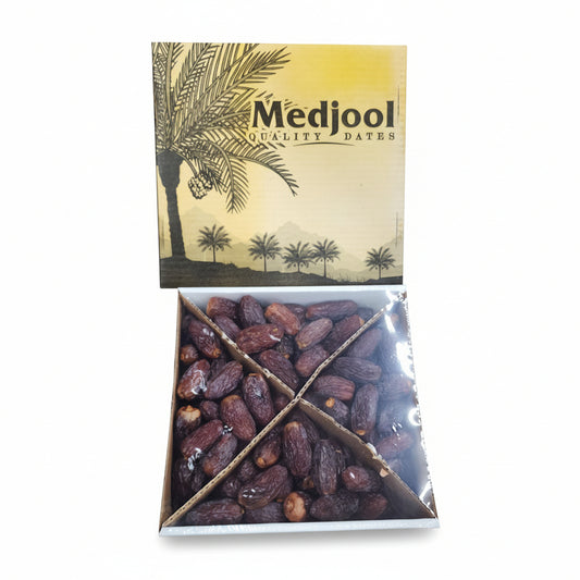 Box of Medjool dates with a palm tree design on a metal surface.