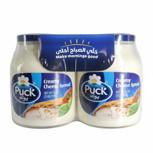Two containers of Puck Creamy Cheese Spread in a shopping cart.