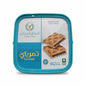 Blue container with baked goods on a white surface