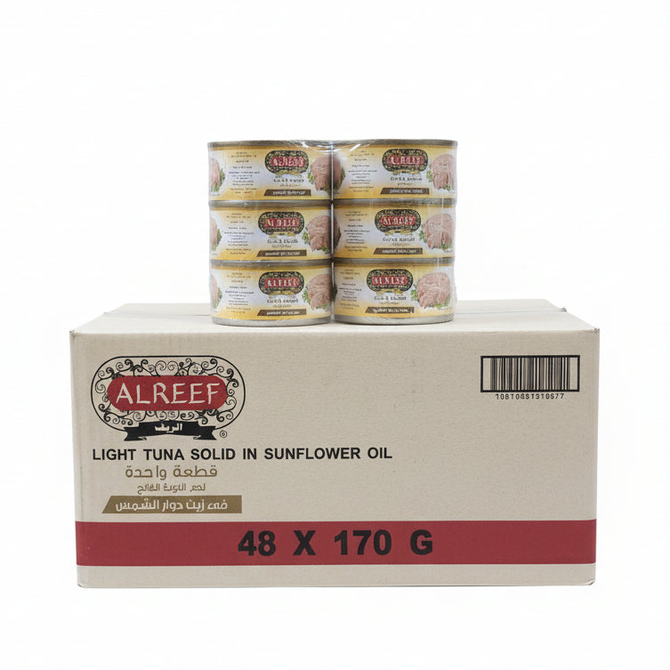 AlReef tuna cans and boxes stacked on a shelf