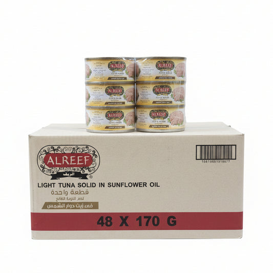 AlReef tuna cans and boxes stacked on a shelf