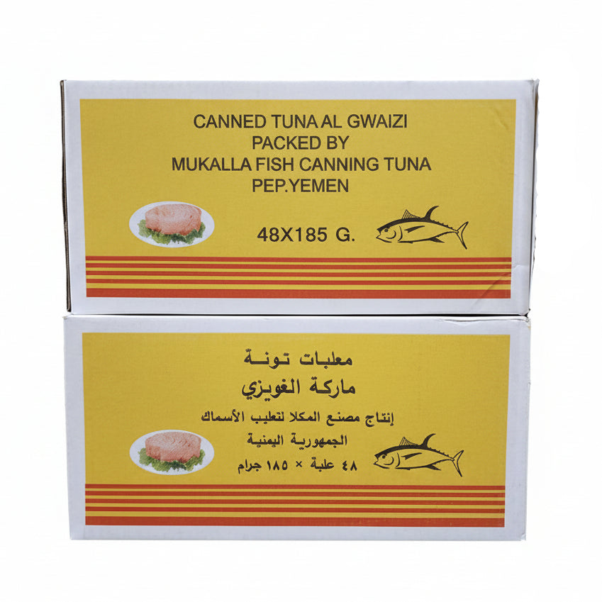 Canned tuna packaging with yellow and red design on a blurred background