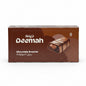 A box of Deemah chocolate brownies on a store shelf, with other packaged goods visible in the background.