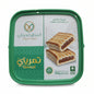 Green container of Tamhali cookies with a white label on a white surface