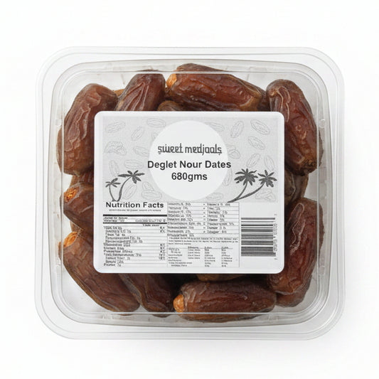 Packaged dried fruits with a label on a metal surface